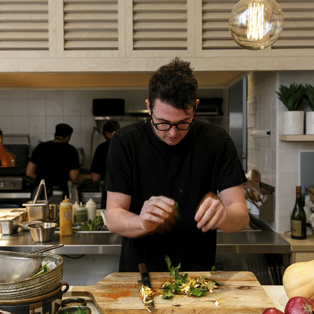 Charlie Carrington adorns a dish.