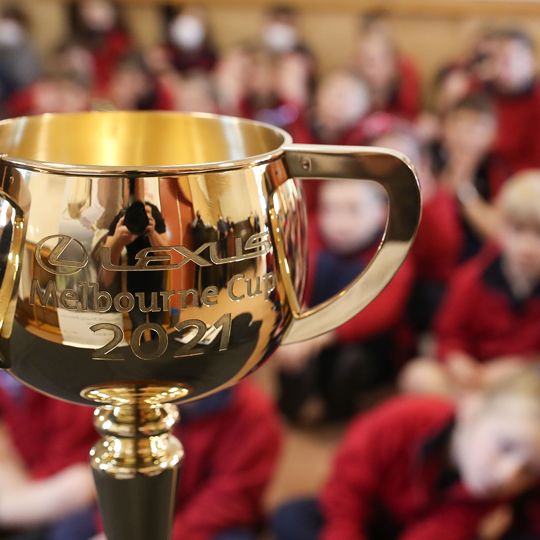 The 2021 Cup on show at a children's school assembly.