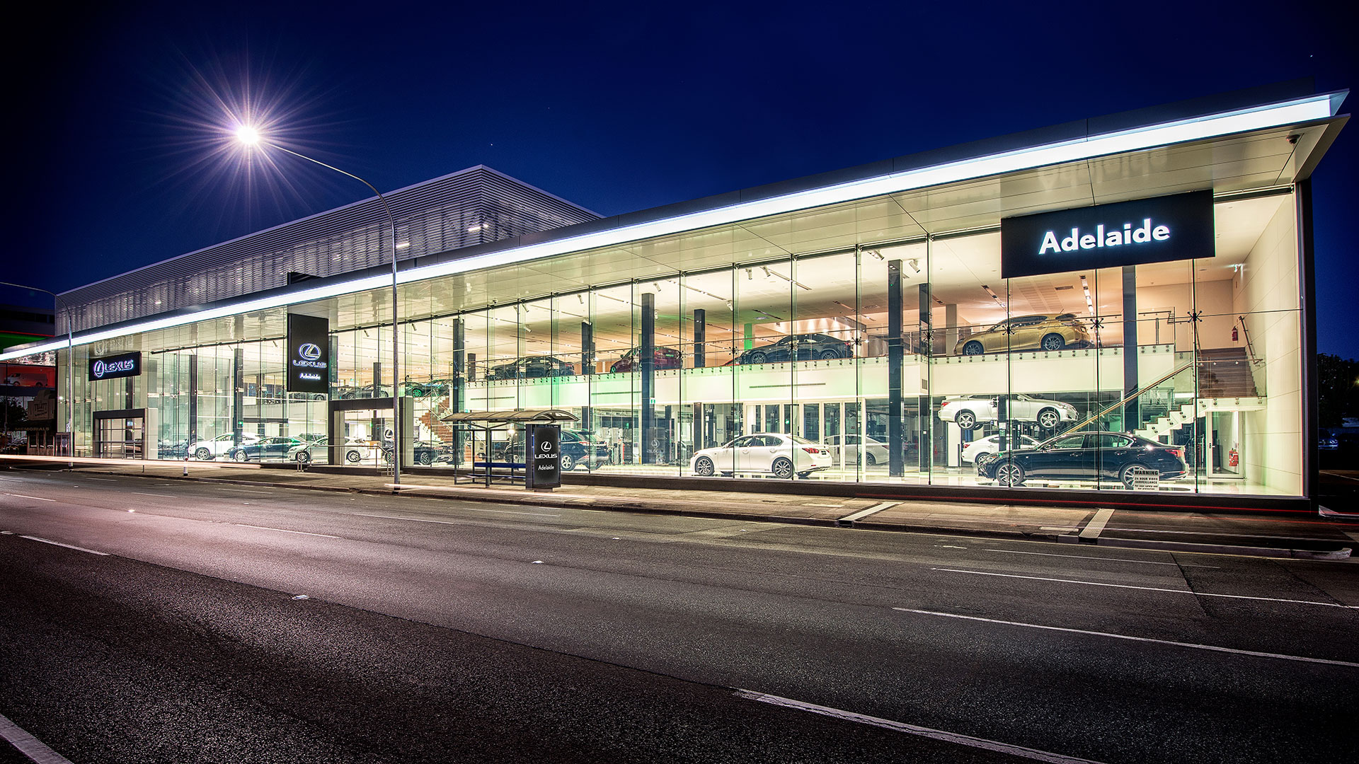 Lexus of Adelaide dealership against a night sky