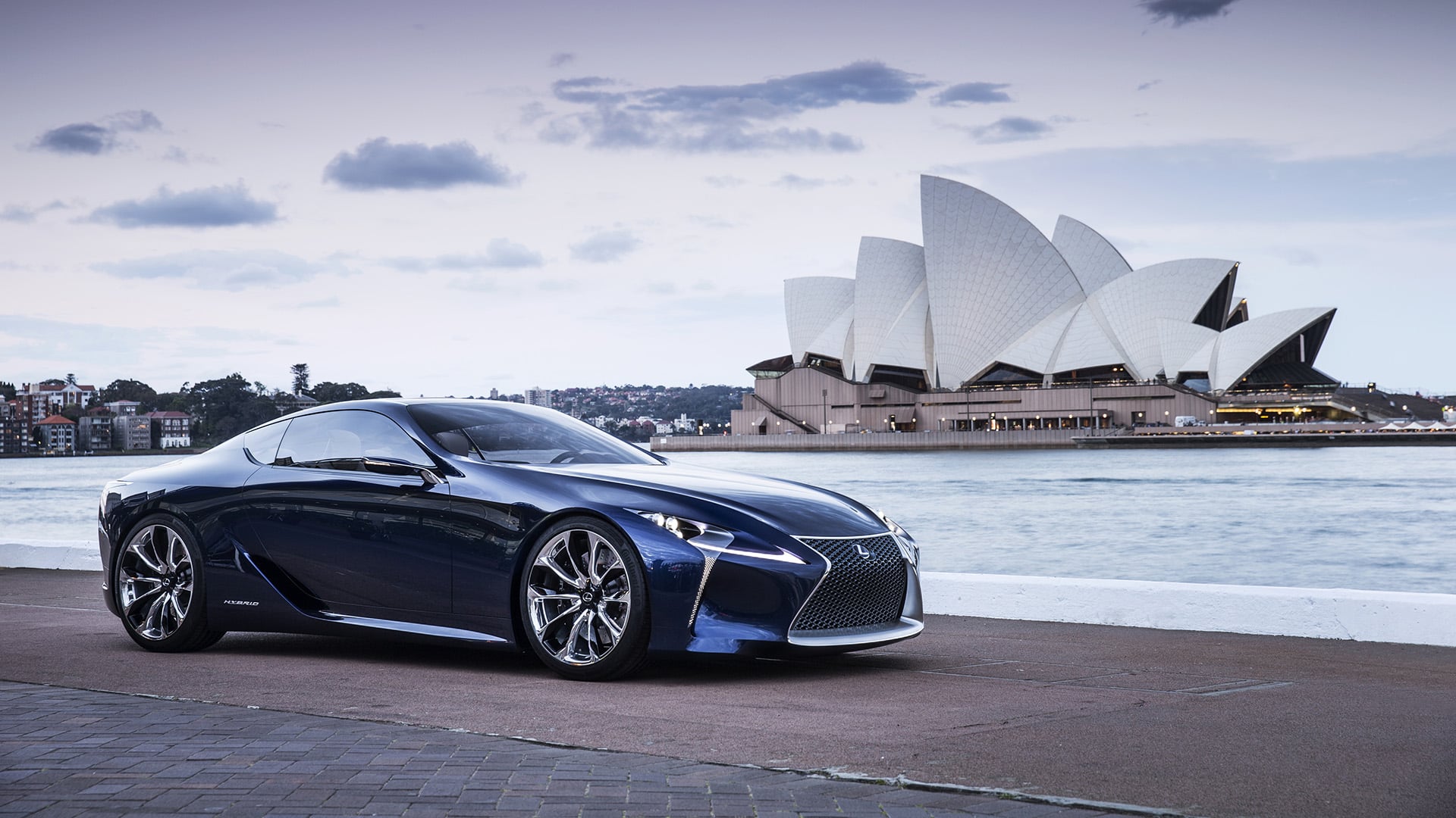 Black Lexus LF-LC Blue concept vehicle parked in front of the Sydney Opera House