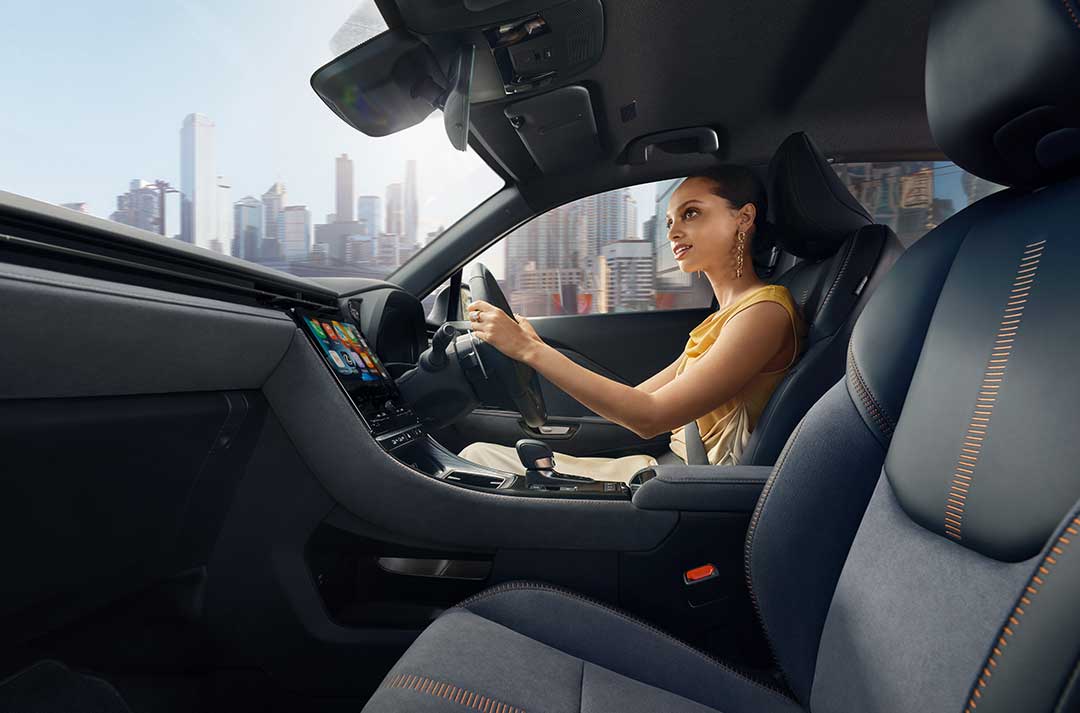 Picture of a woman inside a Lexus car, while driving.
